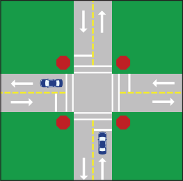 A 4-way intersection with 4 stop signs, crosswalks and a stop line at each right-side lane