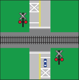 A railroad crossing over a two-way street