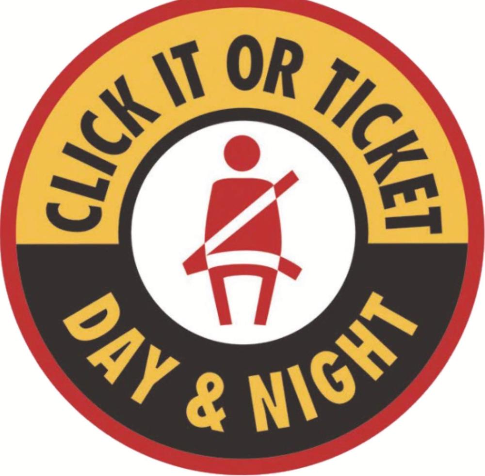 Figure wearing a seatbelt. "Click it or ticket. Day and night."