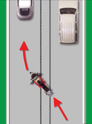 The motocyclist crosses tracks parallel to their course at a 45 degree angle