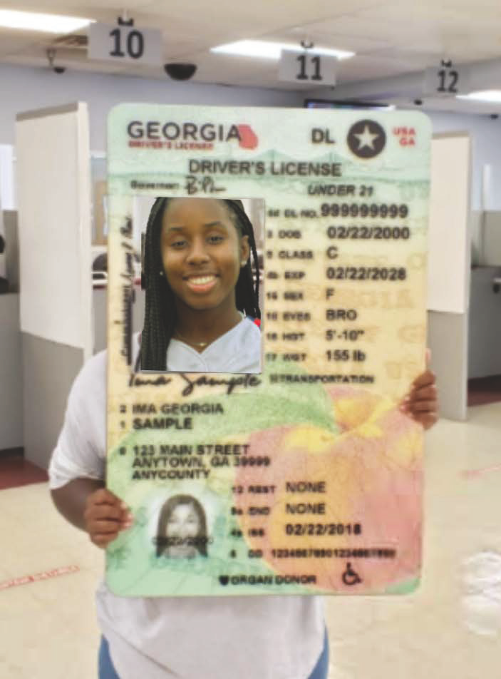 A large Driver's License held up at a DMV