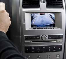 A backup camera set above the car's radio console