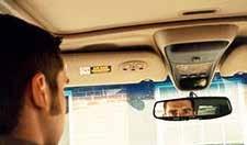 A driver checking their rearview mirror