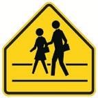 A yellow, pentagonal School Crossing sign