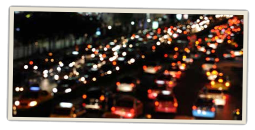 Blurry snapshot of a packed highway at night