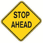 Yellow diamond Stop Ahead sign