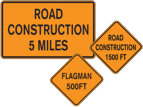 Three orange signs: one rectangular reading "Road Construction 5 Miles," and two diamond reading "Flagman 500FT" and "Road Construction 1500 FT"