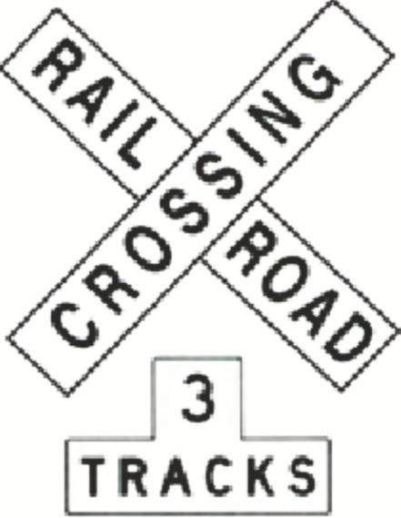 Sign for a railroad crossing with 3 tracks