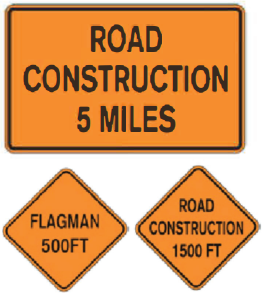 Three orange signs: one rectangular reading "Road Construction 5 Miles," and two diamond reading "Flagman 500FT" and "Road Construction 1500 FT"