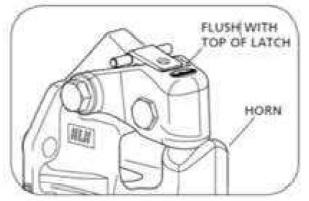 The lock handle is flush with the top of the latch and the horn is underneath