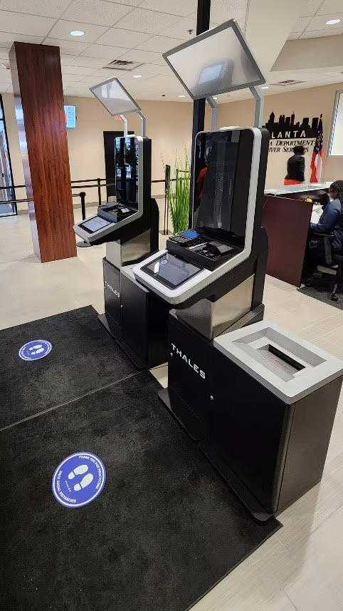 Two Thales Kiosks pictured in the middle of the Atlanta Department of Driver Services Customer Service Center.
